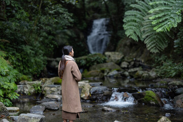 Tourist woman view the Wufengqi waterfall in Yilan of Taiwan