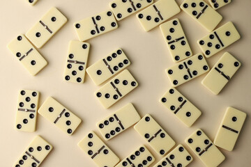 board logic game for the whole family and friends of dominoes. light-colored dominoes with black dots on a light and mirror background