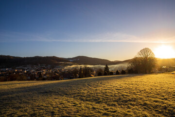sunset in the mountains with church