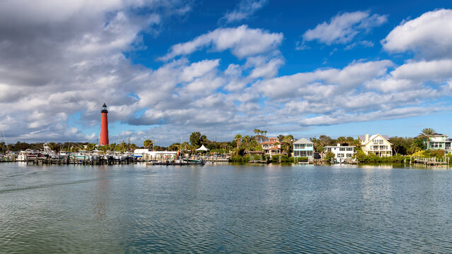 Ponce Inlet Lighthouse in harbor at sunny day, Daytona Beach, Florida, USA.
