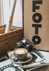 Closeup of a cup of latte with an art pattern on a table in a photo studio