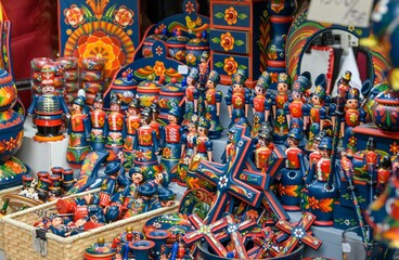 Closeup shot of traditional Hungarian wooden dolls and souvenirs for sale in a market