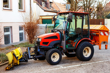 Excavator in the city in the parking lot near the building