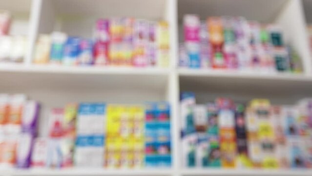 Blurred Background of Medicine on shelve in Pharmacy, Out of focus shot of drugs in drugs store. 