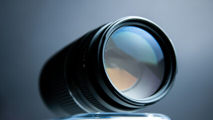 Camera lens on a dark background. Close-up. Selective focus.