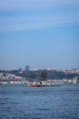 Fototapeta premium Restoration and renovation work, which started in 2022, continues on the Maiden's Tower, which is one of the iconic historical monuments of Istanbul and Turkey. Istanbul, Turkey, March 16, 2023
