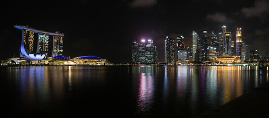 Fototapeta na wymiar Singapore skyline by night with amazing skyscraper modern futuristic buildings in Singapore, 2023.
