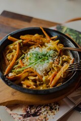 Vertical shot of a tasty dish displayed in the aesthetic environment at a restaurant