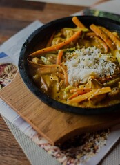 Vertical shot of a tasty dish displayed in the aesthetic environment at a restaurant