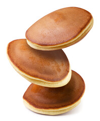 Pancakes flying close up on a white background. - obrazy, fototapety, plakaty