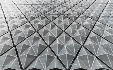 Perforated metal mesh panels on facade. Contemporary surface structure
