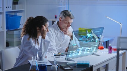 Two lab scientists puzzled with unexpected experiment results on holographic computer screen