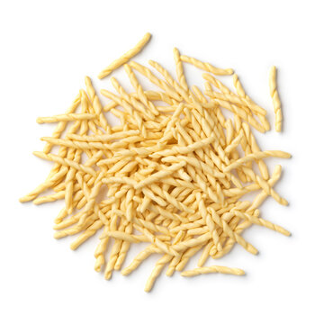 Heap of uncooked talian trofie pasta close up isolated  on white background