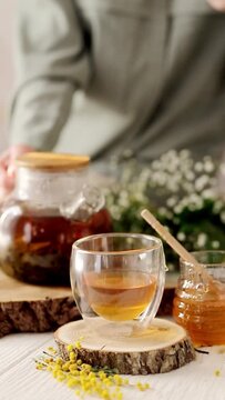 A cup of tea with honey