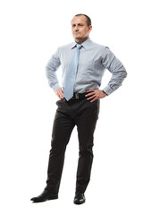 Fototapeta premium Confident businessman with hands on hips