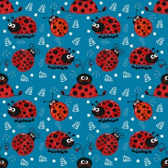 Seamless pattern with ladybirds on blue background 
