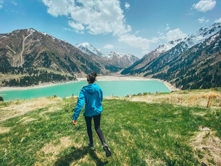 Fototapeta na wymiar Big Almaty lake girl running summer
