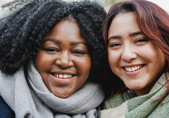 Young multiracial women smiling on camera