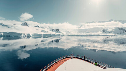 Snow Glacier Covered Mountains Reflecting in the Still Arctic Water of Antarctica, Panorama taken...