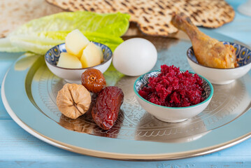 Traditional meal for Passover (Pesach) Seder Plate. Date fruits and walnuts. on the background of symbolic meal for Jewish holiday Pesach.
