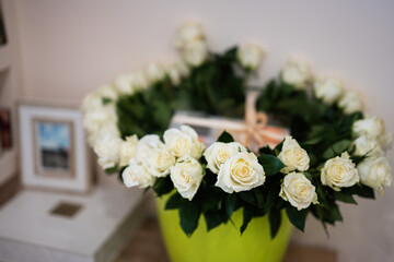 White roses flowers bouquet in pot.