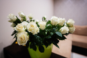White roses flowers bouquet in pot.