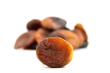 Brown dried apricots isolated on a white background. Brown dried apricots high resolution image. noise effect. Noise and Pollution Effect on photos. Top view.