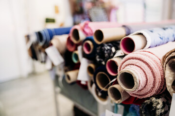 Rolls of fabrics in dressmaker's Atelier. Small business. fabrics shop. nobody