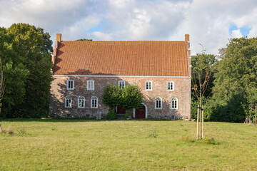 Fototapeta na wymiar Old historic brick building in Aasted Denmark - The medieval castle Østergaard - The place is first mentioned in 1408, when Queen Margrethe I (1353-1412) was on a journey in Jutland.
