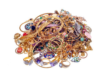 A jumbled Pile of Vintage Jewelry Isolated On White