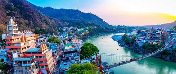 Rishikesh, yoga city India, Ganges River valley, Ganga, Uttarakhand during sunset. Rafting, raft - obrazy, fototapety, plakaty