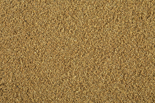 Fennel powder as background, top view. Fresh Indian spice powder.
