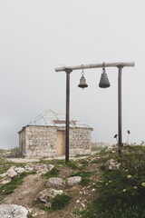 Old stone orthodox Saint Giorgi Church in Khvamli Mountain range in Georgia with simple wooden...