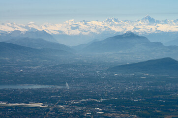 aerial view on Geneva, lake Leman and snowy Alps  - Powered by Adobe