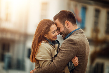 Loving young couple hugging and smiling together