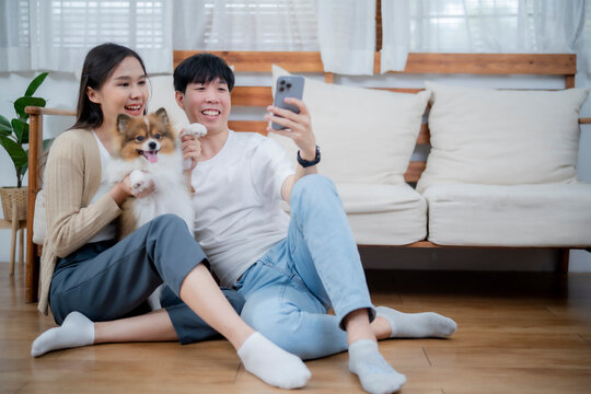 Happy family with cute chi wawa dog selfie together, girl embrass thire dog with love, relationship between human and pet in new way.