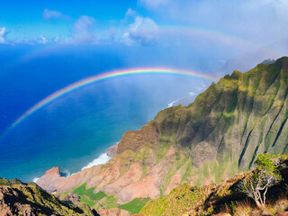 Aerial view of Na Pali Coast with rainbow, Kauai island, Hawaii