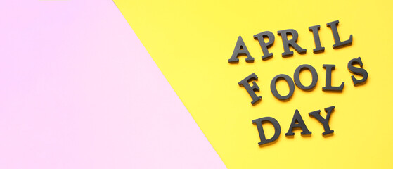Text APRIL FOOLS DAY on color background