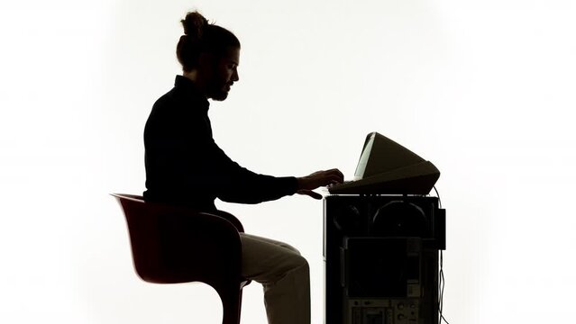 Young man working on a vintage compute
