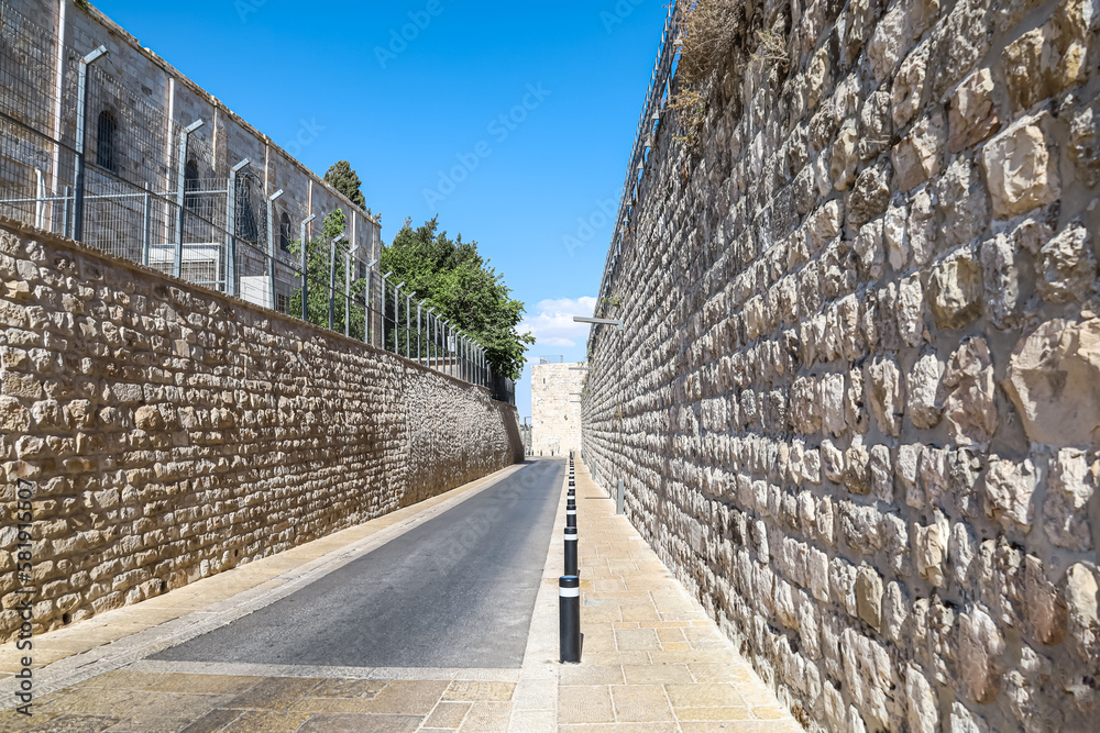 Wall mural beautiful view of stone fence and road