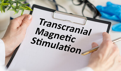 Transcranial Magnetic Stimulation TMS is shown on the photo using the text