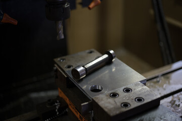 Fototapeta na wymiar Measuring a hole after cutting on a machining center 