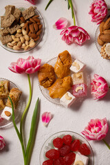 oriental sweets on a light background with tulips