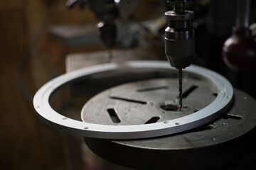 Part machining with drilling machine