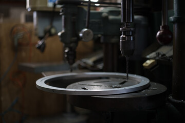 Part machining with drilling machine