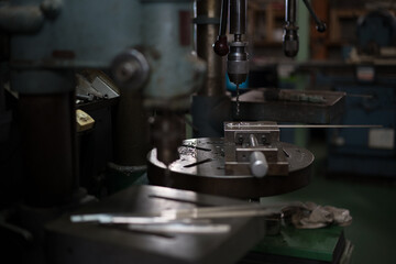 Part machining with drilling machine