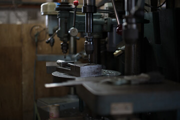 Part machining with drilling machine