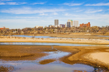 Sunny view of the skyline of Tulsa city from River West Festival Park