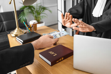 Mature judge refusing to take bribe from man in courtroom, closeup