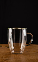 Glass cup, empty glass coffee cup on rustic wood, selective focus.